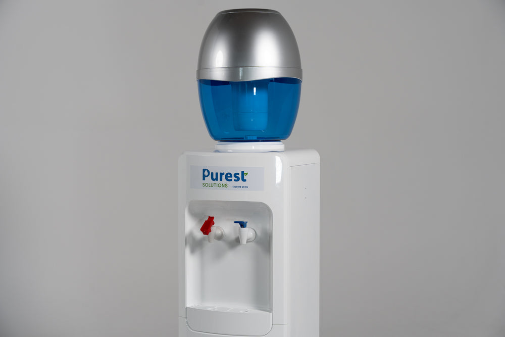 White refillable water cooler detail — hot and cold filtered water dispenser