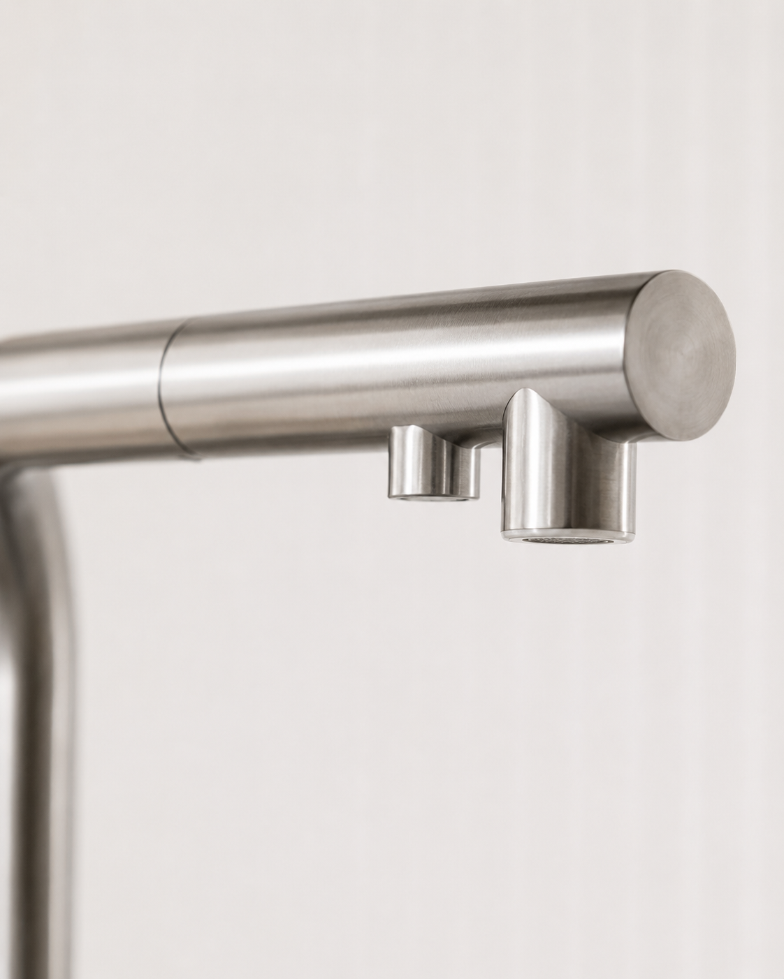 Close-up of the dual-outlet spout head with separate filtered water nozzle